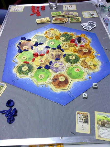 Catan: The Helpers - Cats In Hat Inc.